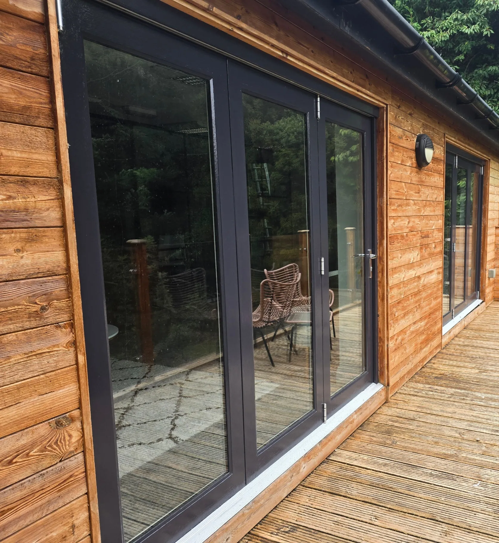 Anthracite grey uPVC bi-fold doors professionally sprayed by Elite Decorators in Lutterworth, Market Harborough, Rugby and Hinckley